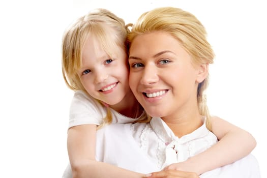 Portrait of little girl embracing woman wearing white clothes