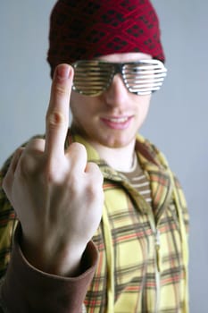 middle finger obscene gesture young cap man with steel glasses