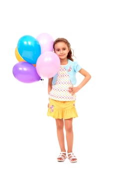 Portrait of happy girl with colorful balloons on white background