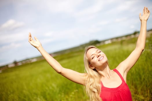 Image of happy female with raised arms enjoying summer day