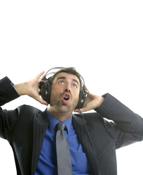 Businessman hearing and singing music with headphones, take a break
