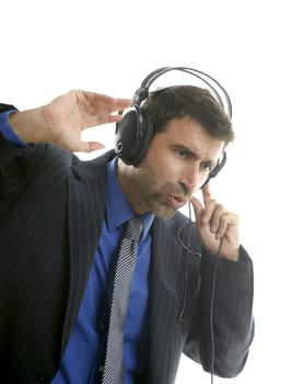 Businessman hearing and singing music with headphones, take a break