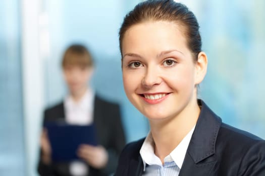 Close-up of young smiling businesswomans face