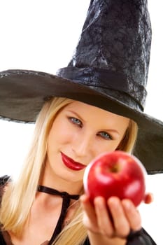 Image of witch giving red ripe apple to somebody