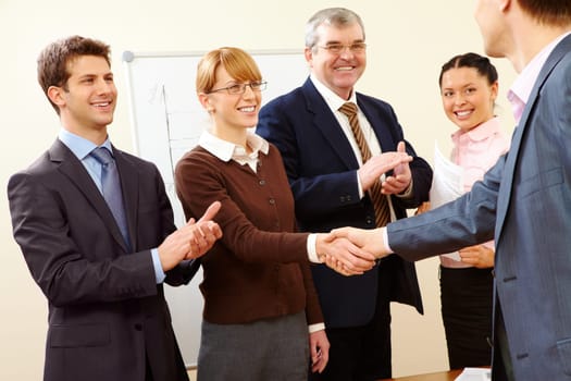 Image of successful handshake after business training