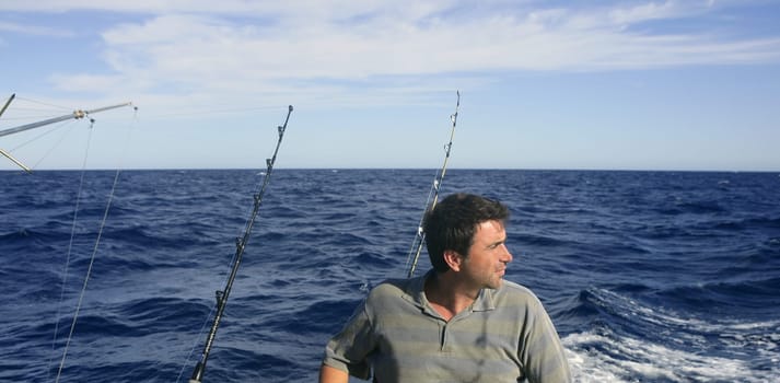 Angler big game saltwater fisher boat with rods and reels