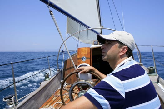 Sailor sailing in the sea. Sailboat over mediterranean blue saltwater