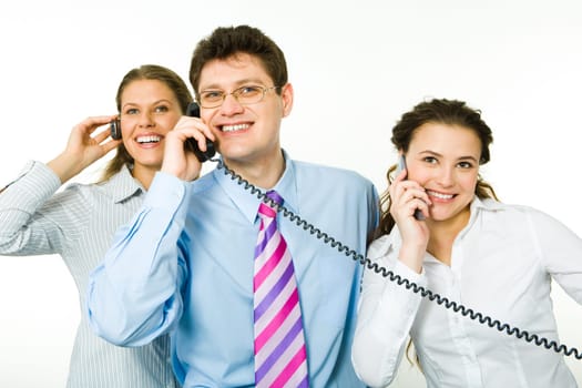 Group of smiling consultants speaking on their phones on white background with man between women