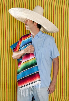 Mexican man serape poncho hat sombrero yellow stripes background