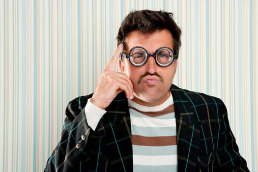 nerd silly myopic man with glasses thinking doing funny gesture with retro mustache