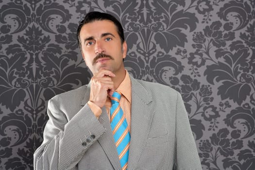 mustache retro salesman with vintage suit and pensive gesture in wallpaper