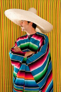 Mexican typical poncho man with sombrero and mustache over yellow background