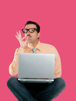 nerd man sit with laptop computer doing ok positive gesture