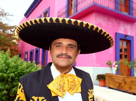 Charro mexican Mariachi man portrait in a pink Mexico house