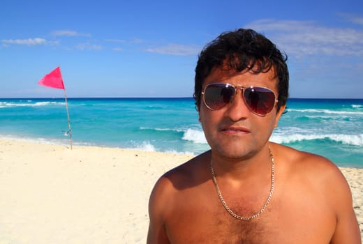 Mexican latin tourist humor suspicios guy in caribbean beach vacation