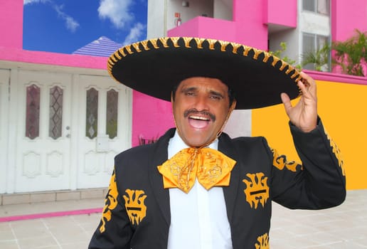Charro mariachi man portrait shouting in mexican pink house