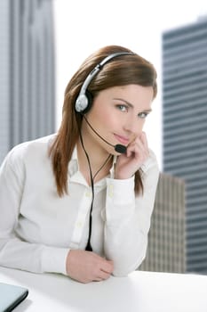 Business helpdesk with beautiful woman and headphones micro