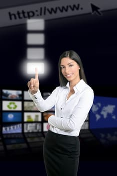 Brunette businesswoman touching virtual pad transparent key with finger