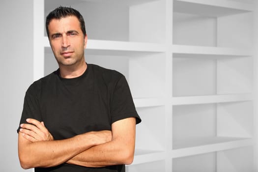 Medium age man posing in interior white house
