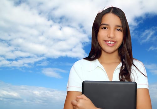 brunette teen student indian latin smile holding laptop over blue sky