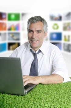 happy senior businessman working green grass desk tv presenter screen