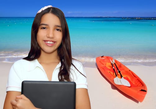 brunette teen  indian latin student holding laptop in vacation beach