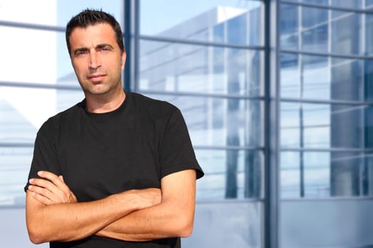 Mid age man portrait in urban modern office buildings