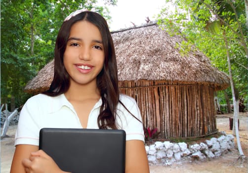 brunette teen student indian latin holding laptop traditional cabin hut jungle