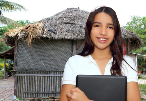 brunette teen student indian latin holding laptop jungle house tropical hut