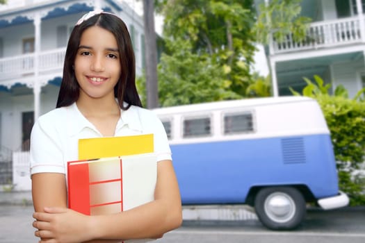 Brunette student young girl teen latin holding books tropical white village Florida