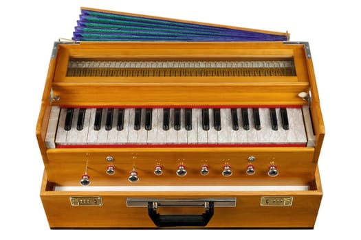 Indian keyboard instrument harmonium on white background