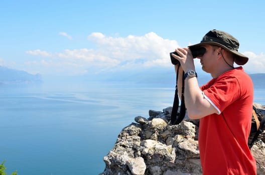 Man looking through binoculars
