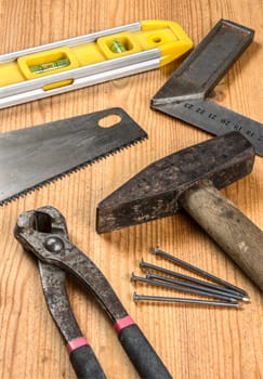 Various tools on wooden surface
