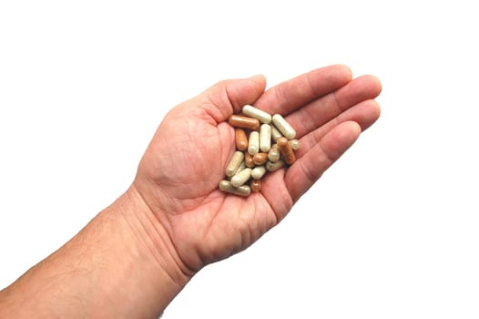 Herbal capsules on a hand