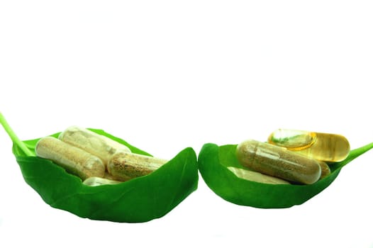 Herbal capsule in basil leaf