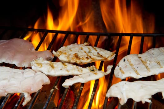chicken breast on grilled with flames