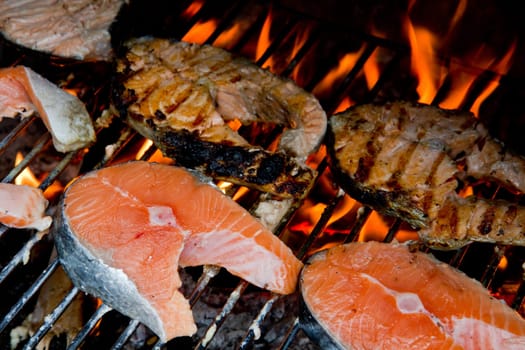 a fresh steak of salmon on grilled with flames