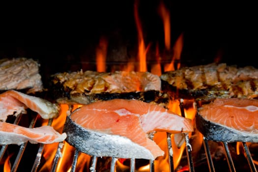 a fresh steak of salmon on grilled with flames