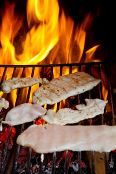 chicken breast on grilled with flames