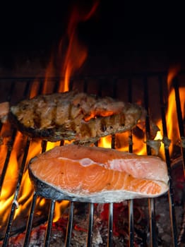 a fresh steak of salmon on grilled with flames