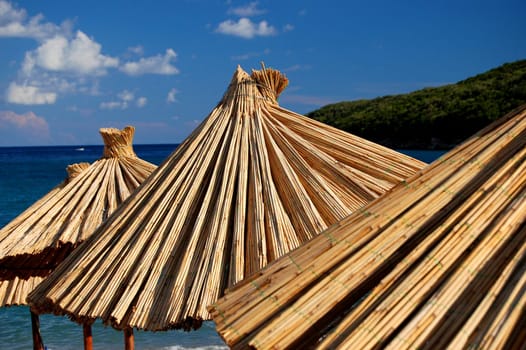 Straw umbrellas on Montenegrin beach