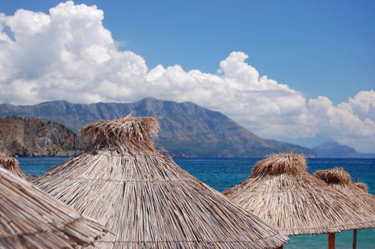Straw umbrellas on Montenegrin beach
