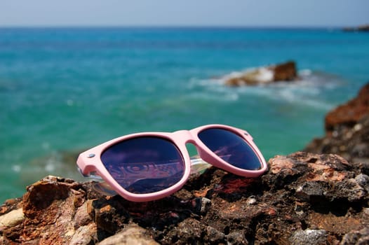 Sunglasses on a sandy beach