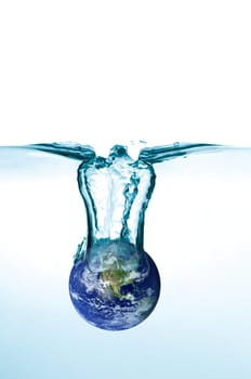 planet earth falling in some blue water