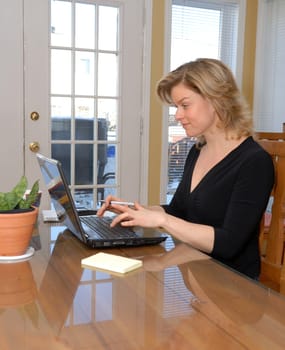 cute blond woman working from her home