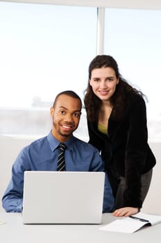 male and female business partners in a window office