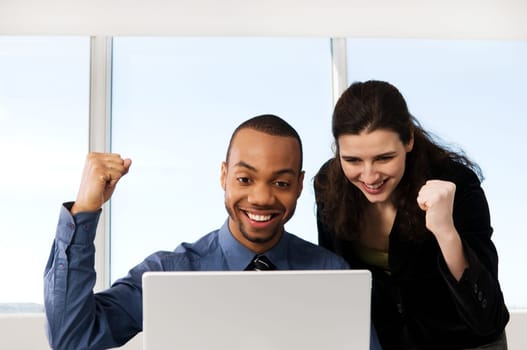 male and female business partners in a window office
