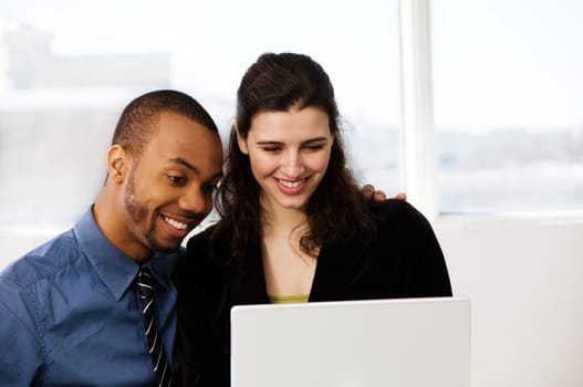 male and female business partners in a window office
