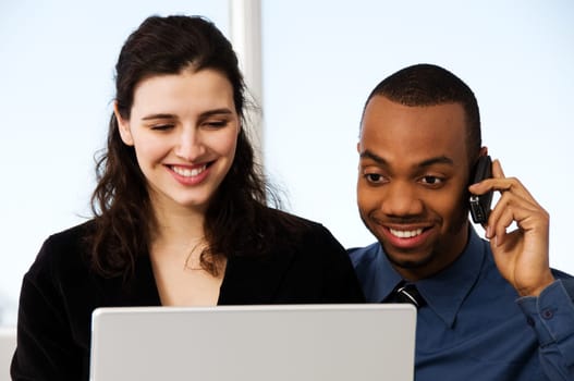 male and female business partners in a window office
