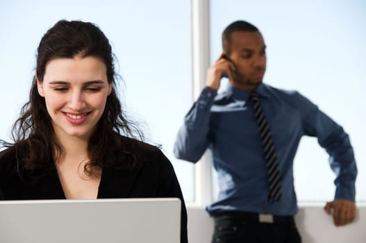 male and female business partners in a window office